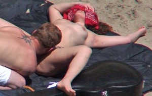 hot babe getting her pussy licked at the beach